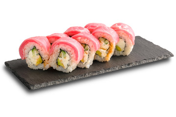 Sushi Rolls with tuna, cucumber, avocado and Cream Cheese inside on black slate isolated on white background.