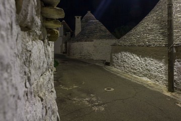 ALBEROBELLO, ITALY - AIGUST 28 2017: Night view of an alley in Alberobello, south of Italy