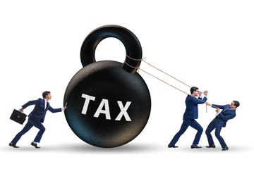 Businessman pulling kettlebell in tax concept