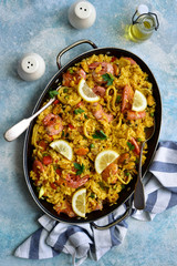 Paella - traditional dish of spanish cuisine. Top view with copy space.