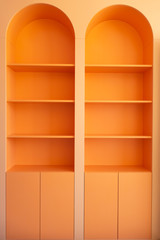 Beautiful orange wardrobe with arched elements. Creative vintage background.