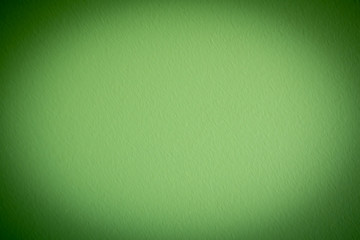 Green background with vignetting. Creative vintage background. Place for text.