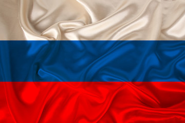 photo of the national flag of Russia on a luxurious texture of satin, silk with waves, folds and highlights, close-up, copy space, concept of travel, economy and state policy, illustration