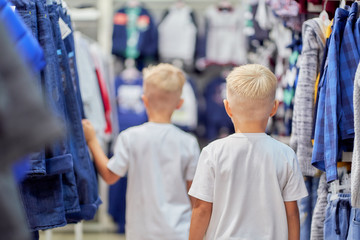 two little boys in a clothing store