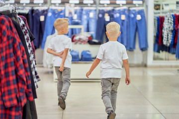 two little boys in a clothing store