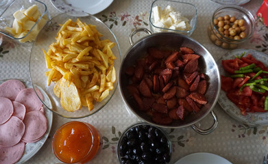 breakfast time, breakfast table french fries, jam, butter, cheese, tea, olives, bread etc ...