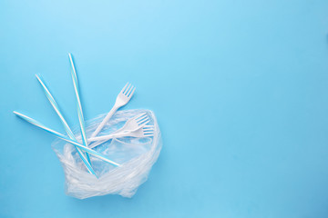 Plastic garbage on blue background. Ecological, environmental pollution, recycling and zero waste...
