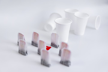 The image of a brawl in the form of tea bags and plastic glasses