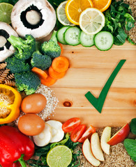 Healthy fresh food, vitamins, vegetables, salad, dairy, greens and fruit - health concept for good nutrition, a balanced diet, fitness and vitality.