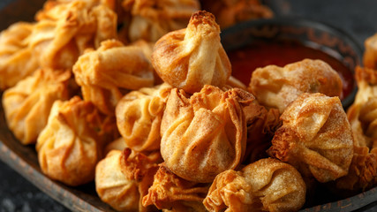 Chinese takeaway finger food Vegetable wontons with sweet chilli dip sauce