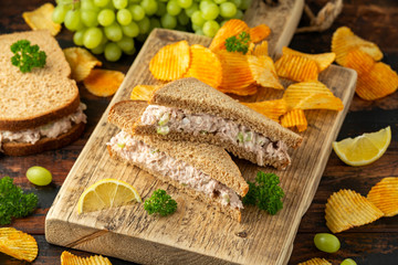Healthy Tuna Sandwich with celery and onion on wooden board