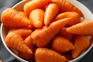 Mini chantenay carrots in a white bowl