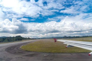 Plane taking a curve to get on the airport runway. Colombia