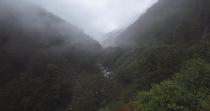 Fog on Freezy Morning Over River Canyon With Stee[ Hills and Forest, Aerial