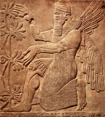 Assyrian relief of god, art of Middle East, Babylonian and Sumerian civilization history - obrazy, fototapety, plakaty