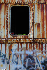 Vertical image of an abandoned railway passenger car