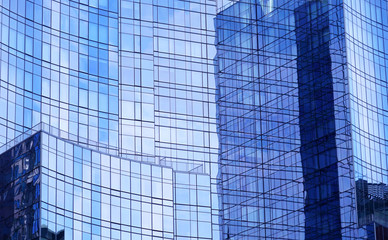 close up on modern office building with blue glass windows