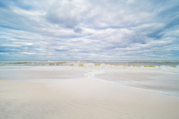Ocean. Beach with white sand and cloudy sky