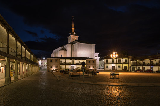 Colmenar de Oreja arcaded square illuminated at night, Madrid, Spain.
