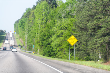 Interstate highway 85 road with sign Caution Bridge May Ice in Winter in city of Atlanta, Georgia...