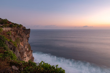 Sunset view over the sea from Uluwatu temple, Bali island