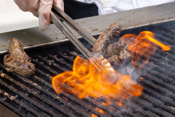 Meat on a grill at an Arab festival.
