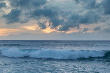 Obraz na płótnie Canvas Beautiful sunset shoreline at tropical sandy beach in Oahu island, Hawaii