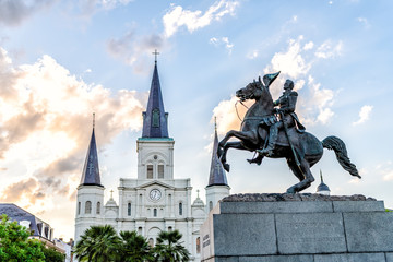 Old town New Orleans, Louisiana town city with St Louis cathedral and general statue in Jackson Square at sunset with dramatic blue sky
