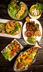 Thai food put on the woodenboard.