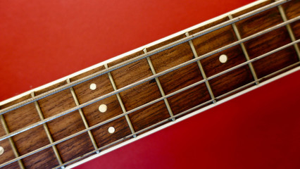 bass guitar neck . color background. closeup