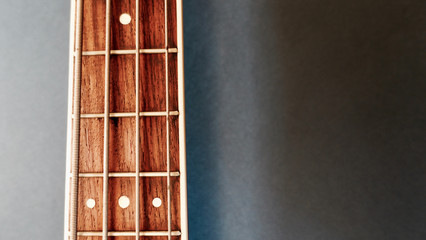 bass guitar neck . color background. closeup