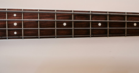 bass guitar neck . color background. closeup