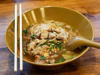 Tom Yum Pork Noodle , Tom Yum Noodle Soup, Spicy Thai noodle style, Close up of Thai noodle spicy soup with pork also known as Tom Yum, Thai food.