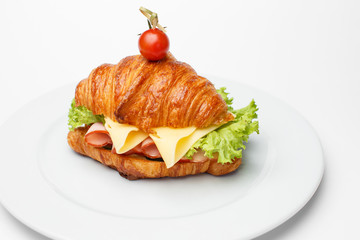 croissant with a cheese and a bacon
