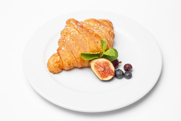 croissant with a berry and a figs