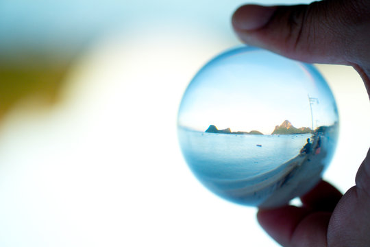 Panoramic view of the beach through the glass ball