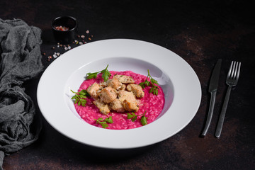 Delicious risotto with roasted pieces of chicken fillet. Risotto with chicken pieces. 