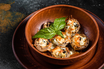 Caps of mushrooms champagne stuffed with four varieties of cheese and baked. Traditional Italian Mushroom Caps stuffed with Feta