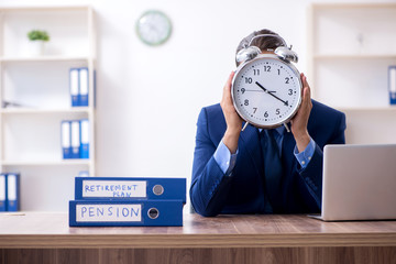 Young male accountant working in the office
