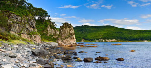 Seascape-rocky shore on wild Bay with seagulls. View of the wild Bay of Primorsky Krai.