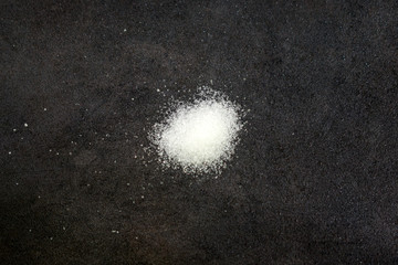 Cocaine drug powder on a dark background.
