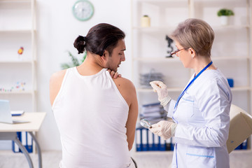 Fototapeta premium Young patient visiting doctor in hospital