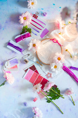 Blank embroidery frame in pastel tones with flowers and DIY tools. Feminine workplace concept