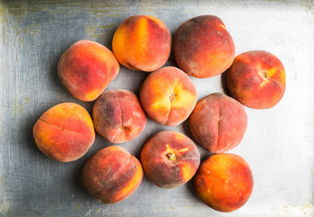 Sweet ripe peaches on the rustic background. Selective focus. Shallow depth of field.