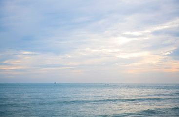 The sea the morning  amidst the clouds and the sky is beautiful quiet atmosphere feeling lonely