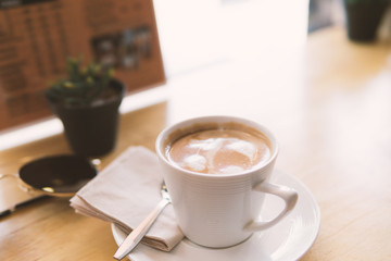 cup of coffee on table in cafe