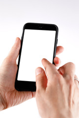 Touch screen smartphone in a hand.Man holding smartphone with blank screen on white background, closeup of hand.