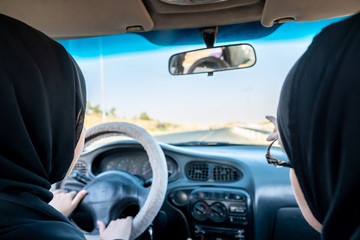 Two arabic women driving while arguing