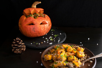 Baked Halloween pumpkin stuffed with lentil salad
