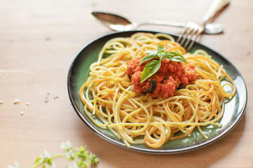 Colarful pasta in a green plate
